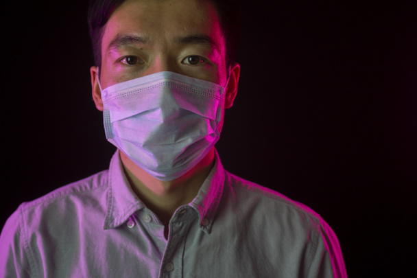 Κινέζος με ιατρική μάσκα. Πανδημική ασθένεια. Κίνδυνος. Κινεζικός κορωνοϊός - Φωτογραφία, εικόνα