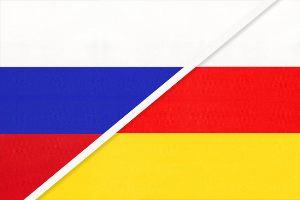 Rusland of Russische Federatie vs Republiek Zuid-Ossetië nationale vlag uit textiel. Betrekkingen, partnerschap en economie tussen twee Europese en Aziatische landen. - Foto, afbeelding