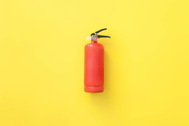 Fire extinguisher on color background - Photo, image