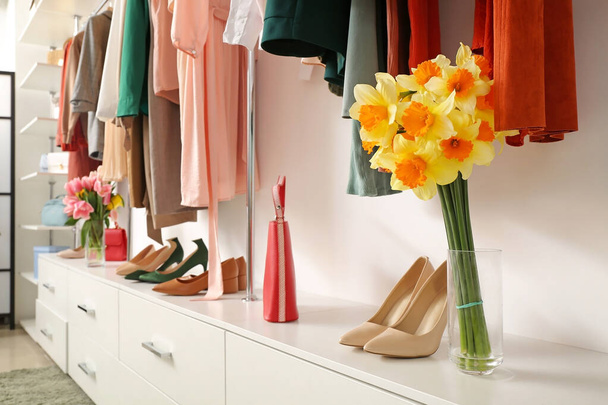 Modern wardrobe with stylish spring clothes and accessories - Photo, Image