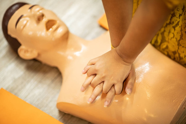 First Aids Emergency CPR training for rescue Heart Attack push hands on chest for sample and testing for right way to rescue,Selective Focus,Rescue Concept - Foto, Imagem