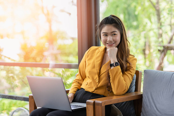 Business Asian young woman working with computer laptop and thinking to get ideas and requirement in Business startup feeling so happiness,Small Business Startup Concept - Photo, Image