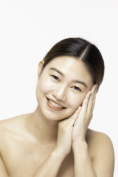 Attractive Charming Asian young woman smile with white teeth and touching soft cheek feeling so happy and cheerful with healthy Clean and Fresh Skin,isolated on white,Beauty Cosmetology Concept - Foto, Imagem