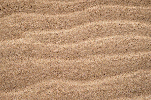 Textura dorada de arena. Primer plano de arena en la playa utilizando como fondo. Hermoso desierto
 - Foto, imagen