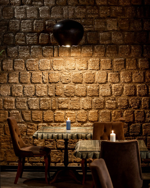 stone-walled restaurant and top lighting - Foto, afbeelding