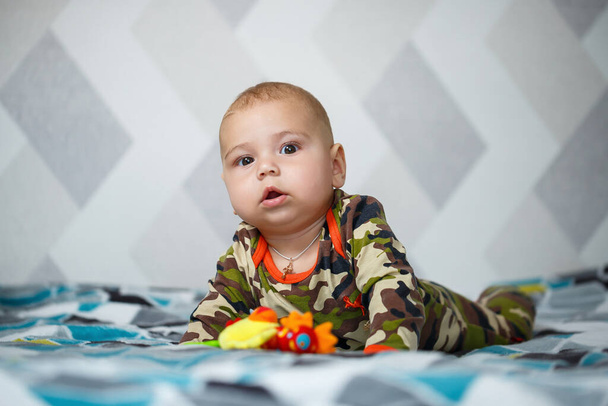 portrait of a little boy age 8 months and is smiling. Health and development of children - Фото, зображення