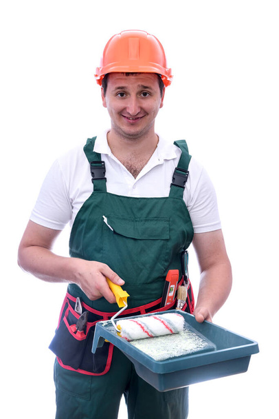 Man in coverall with painting tray isolated on white - Photo, Image