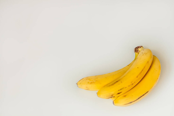 three bananas on a white background isolated - Foto, afbeelding
