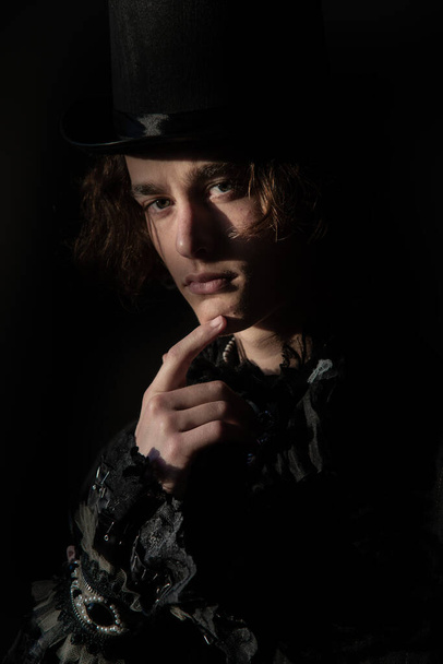 The young man in a top hat, tailcoat, lace. Portrait. Boho. - Fotografie, Obrázek