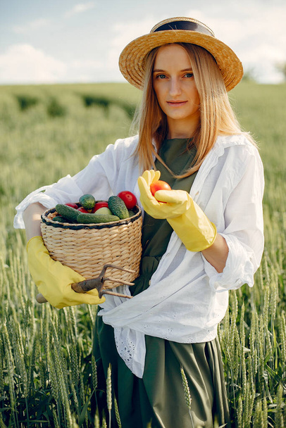 Beautiful woman in a summer field - Фото, зображення