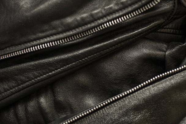 texture en cuir noir avec fermeture éclair métallique pour les vêtements
 - Photo, image