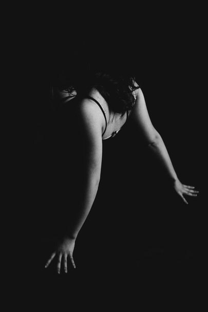 Black and white portrait of sexy girl, erotic beautiful woman in dark, fashion and art studio portrait  - Valokuva, kuva