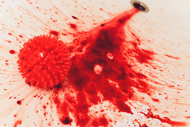 Splashes of blood dripping into the sink in the bathroom. red virus molecules - Foto, Imagen