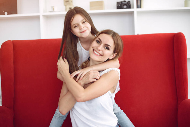 Mother and little daughter have fun at home - Фото, изображение