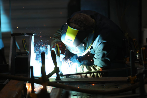 Minsk, Belarus - December 13, 2018 : A worker at the factory welding iron - Φωτογραφία, εικόνα