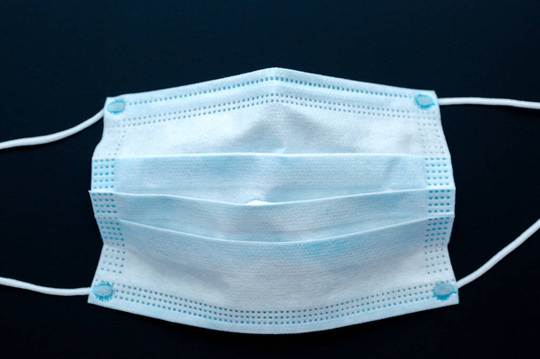 Respiratory medical mask. Medical protective mask isolated. Disposable surgical face mask cover the mouth and nose. Healthcare and medical concept. - Photo, Image