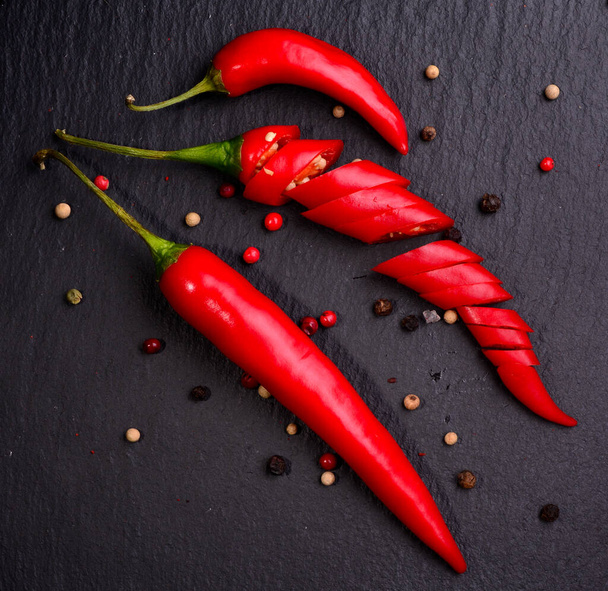Fresh Chili pepper on dark background. Close-up - 写真・画像
