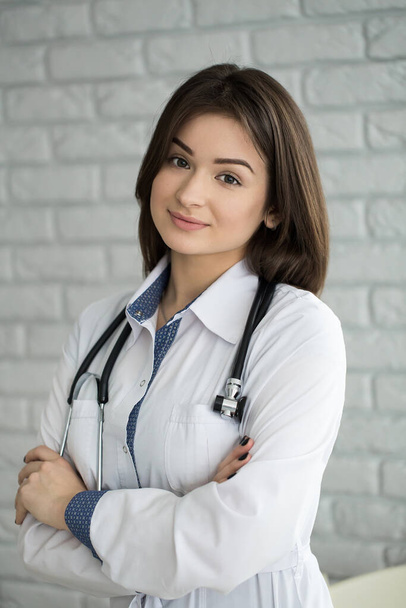 Portrait of happy smiling doctor woman with stethoscope. - Фото, изображение