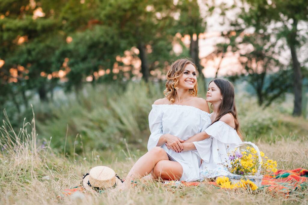 Young mother and her daughter have fun, mother's Day. - Φωτογραφία, εικόνα