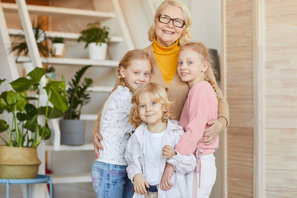 Happy grandmother with her grandchildren - Valokuva, kuva