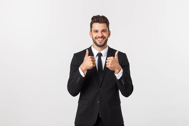 Portrait businessman showing thumbs-up sign on white background - Foto, Imagen
