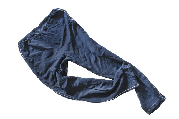 Blue crumpled sport cotton pants on white background - Foto, afbeelding