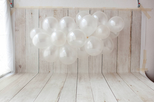 Balloon garland on wooden background. - Photo, Image