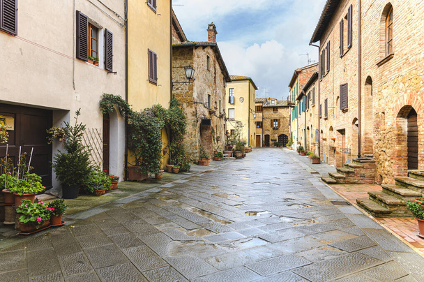Walk on a rainy day through the streets of the beautiful town, Pienza, Tuscany - Photo, Image