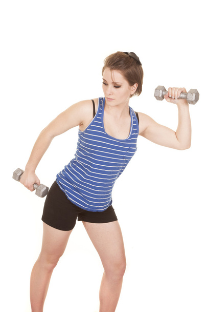 woman blue striped tank fitness weights on up - Foto, Imagen