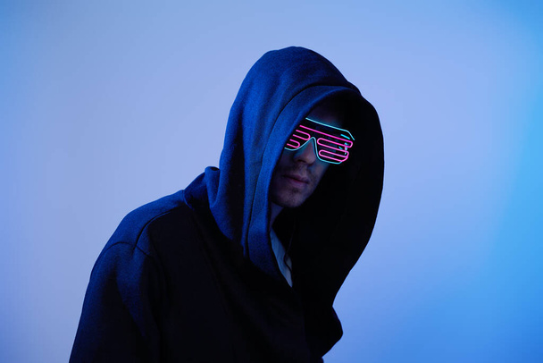 Man in hood and cyber glasses. Game character. - Zdjęcie, obraz