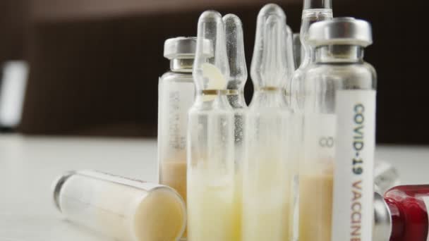 A lot of ampoules and vials of vaccine, and the tests for coronavirus nCoV. - Materiaali, video