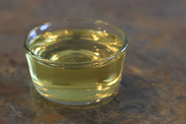 isolated photo of a glass container of olive oil. - Photo, Image