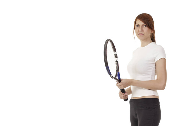 Menina com uma raquete de tênis em um fundo branco
 - Foto, Imagem