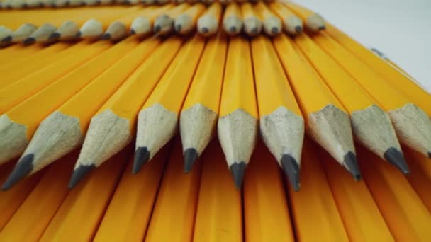 many yellow pencils lie in rows. macro shot on laowa 24mm lens - Footage, Video