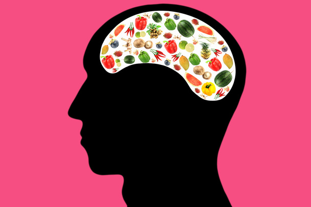 Овощи и фрукты в голове на розовом фоне
. - Фото, изображение