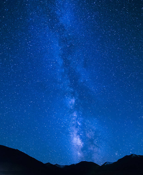 Mountains below milky way with blue sky - Photo, Image