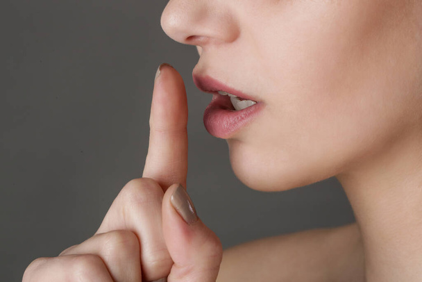 Finger on lips - silent gesture - Photo, Image