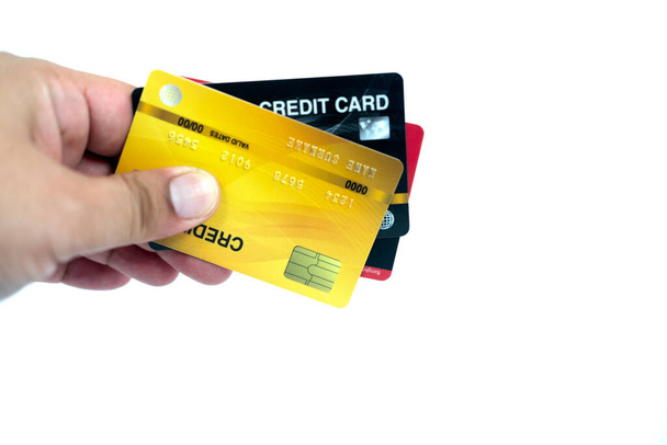 Man hand holding pack of plastic credit card. Isolated on white. - Foto, afbeelding