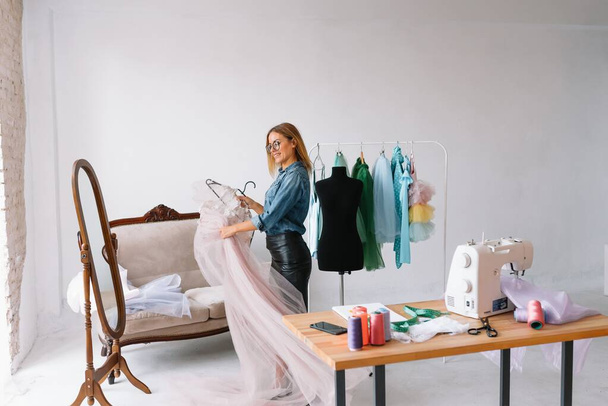 Fashion designer working on her designs in the studio - Photo, Image