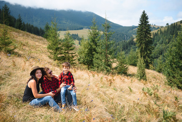 young family on active vacation in the mountains. Travel to the mountains for summer vacation. National Park. - 写真・画像