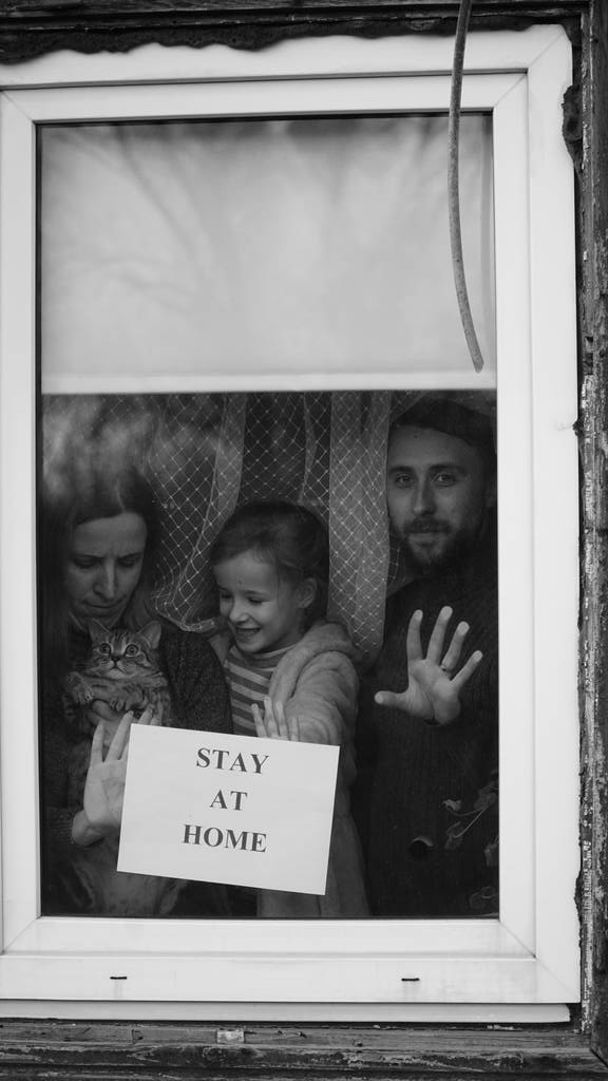 Lettering Stay Home Safe Campaign. A happy european family remained at quarantine self-isolation. Pandemic coronavirus covid 19 responsibility conscious decision. message poster preventive measures. - Photo, Image