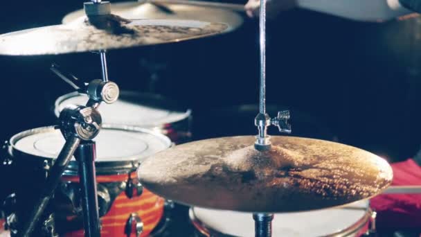 Drummer, drumset, drums in slow motion A man plays wet drums, hitting cymbals. - Materiał filmowy, wideo