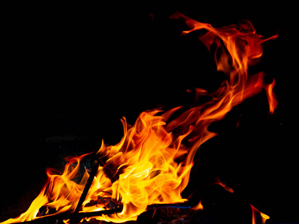 Hot fire with flames and black background - Photo, Image