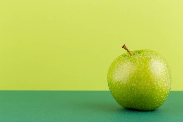 Creative layout made of green apples. Flat lay. Food concept. - 写真・画像