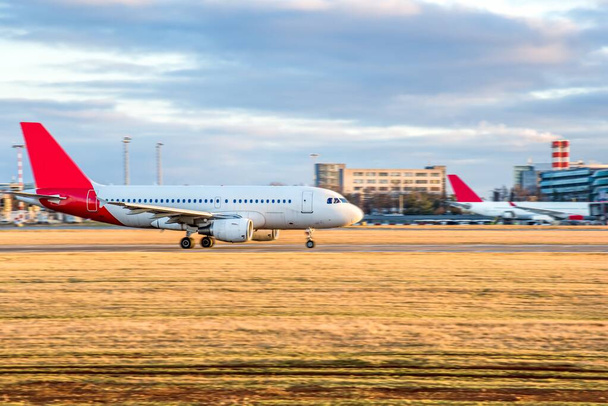 Aircraft take-off into the sky against the background of the airport . Aircraft against sky background , passenger traffic - Photo, Image