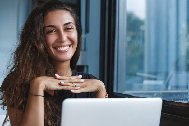 Self-quarantine, personal growth and development concept. Smiling woman working with computer remote home, employee get ready for online video-call interview, learning new skills while on lockdown - Φωτογραφία, εικόνα