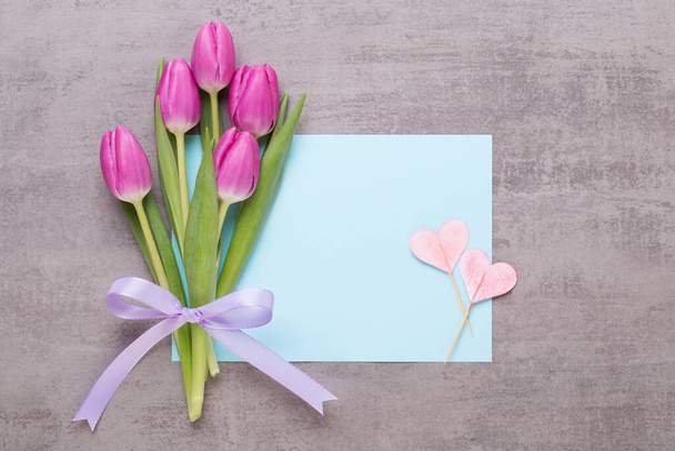 Spring flowers, greeting card, pastel color tulips on the gray background. - 写真・画像