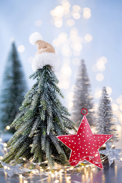 Christmas tree on blue bokeh background. - Φωτογραφία, εικόνα