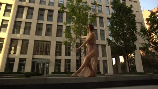 Beautiful young girl dancing performing contemporary on the street of a modern city. Slow motion. - 映像、動画