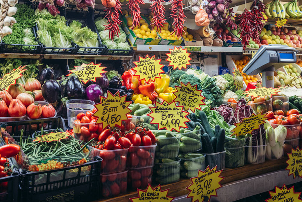 Bologna, Italy - September 30, 2019: Vegetables and fruit stall in covered food market called Mercato Delle Erbe in Bologna city - 写真・画像